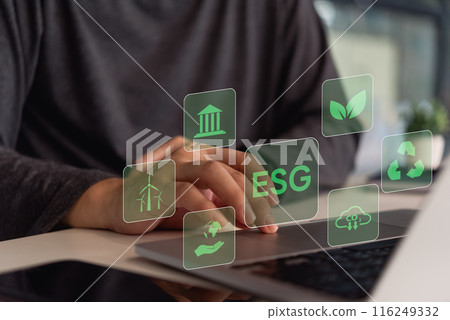 A person interacts with a digital interface showing icons related to ESG (Environmental, Social, Governance) principles.. A person interacts with a digital interface showing icons related to ESG (Environmental, Social, Governance) principles.. 116249332