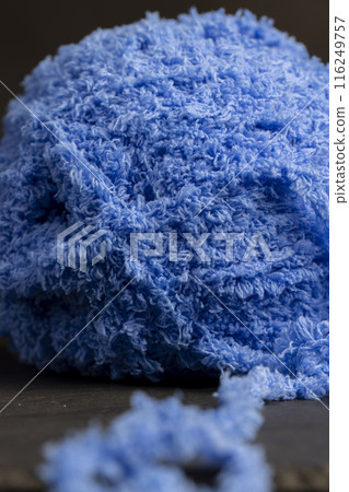 new soft blue threads with traces of other threads close-up new soft blue threads with traces of other threads close-up 116249757