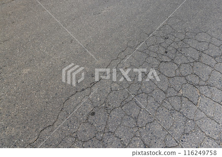 a part of a highway covered with cracked asphalt a part of a highway covered with cracked asphalt 116249758