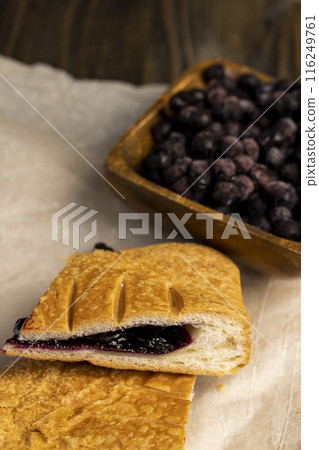 blueberry jam as a filling for a bun 116249761