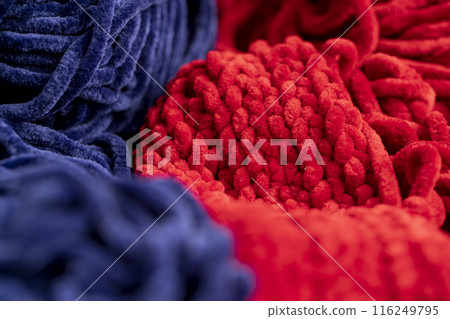 new soft blue threads with traces of other threads in close-up new soft blue threads with traces of other threads in close-up 116249795