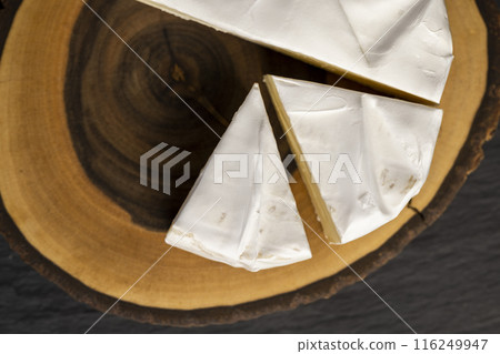 melted cheese with white mold on the table 116249947