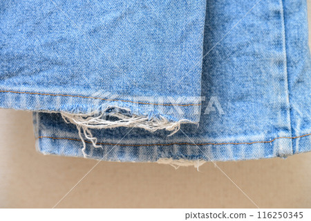 Jeans with frayed cuffs Jeans with frayed cuffs 116250345