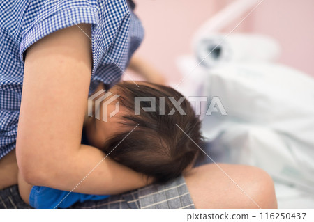 Patient girl feed breastmilk by her mom in hospital Patient girl feed breastmilk by her mom in hospital 116250437