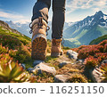 Low angle view of people walking on mountain trail in hiking boots 116251150