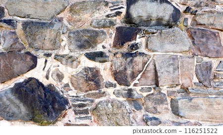 Exterior stone brick wall angled shape medieval Dark grey texture and background Exterior stone brick wall angled shape medieval Dark grey texture and background 116251522