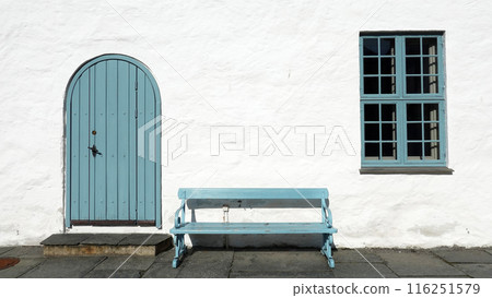 white wall with pastel blue door and window in Oslo, Norway 116251579