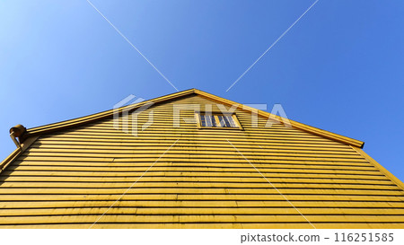yellow textured wall horizontal with blue sky yellow textured wall horizontal with blue sky 116251585