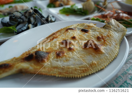 Grilled flounder crispy on the outside and soft on the inside Grilled flounder crispy on the outside and soft on the inside 116251621