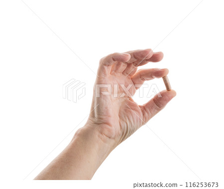 Mid aged female hold beige pills isolated on white Mid aged female hold beige pills isolated on white 116253673