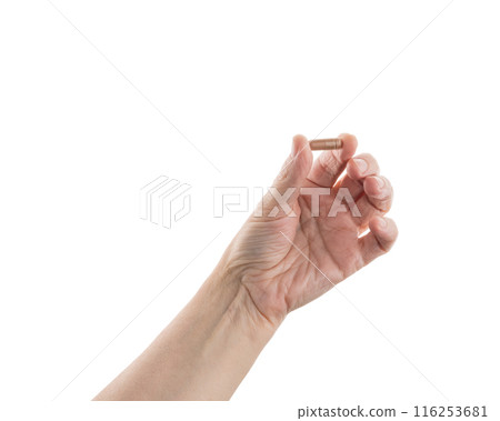 Mid aged female hold beige pills isolated on white 116253681