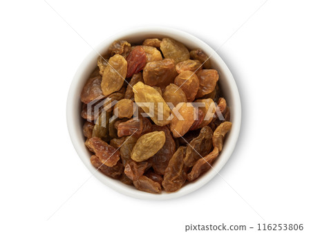 Ceramic bowl with sweet large yellow organic raisins made from green grapes Ceramic bowl with sweet large yellow organic raisins made from green grapes 116253806