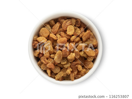 Ceramic bowl with sweet small yellow raisins made from green grapes isolated Ceramic bowl with sweet small yellow raisins made from green grapes isolated 116253807