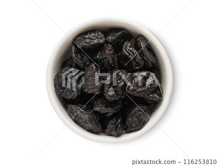 Ceramic bowl with sweet dried plums prunes isolated on white background. Ceramic bowl with sweet dried plums prunes isolated on white background. 116253810