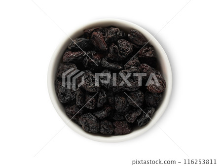 Ceramic bowl with sweet dried plums prunes isolated on white background. 116253811