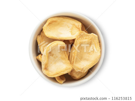 Ceramic bowl with dried breadfruit pieces isolated on white background. Ceramic bowl with dried breadfruit pieces isolated on white background. 116253815