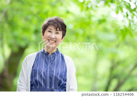Senior woman fresh green portrait Senior woman fresh green portrait 116254406