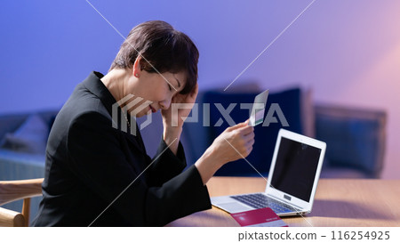 Woman in mourning clothes, bankbook, worries Woman in mourning clothes, bankbook, worries 116254925