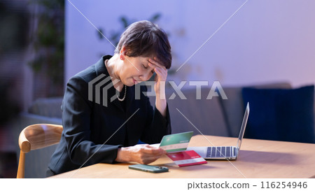 Woman in mourning clothes, bankbook, worries Woman in mourning clothes, bankbook, worries 116254946