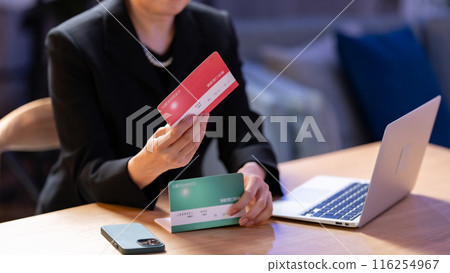 Woman in mourning clothes, bankbook, worries, hand Woman in mourning clothes, bankbook, worries, hand 116254967