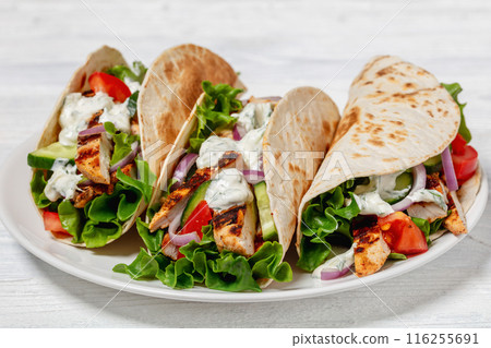 grilled chicken street tacos on a white plate 116255691