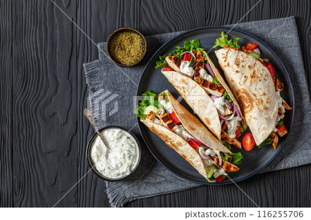 grilled chicken street tacos on a dark plate 116255706