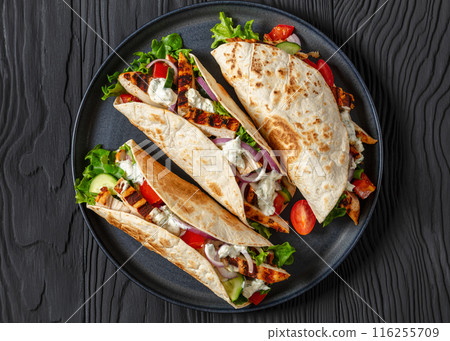 grilled chicken street tacos on a dark plate 116255709