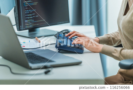 close up  developer hand coding with keyboard on desk  at modern office 116256066