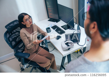 Asian software developer discussion about coding project on computer screen at moden office Asian software developer discussion about coding project on computer screen at moden office 116256095