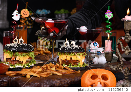 Witch's cocktail with eyeballs in a martini glass 116256340