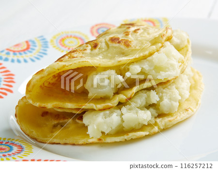 Qistibi. roasted flatbreads with potatoes 116257212