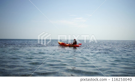 Kayak sea woman. Happy attractive woman with long hair in red swimsuit, swimming on kayak. Summer holiday vacation and travel concept. 116258040