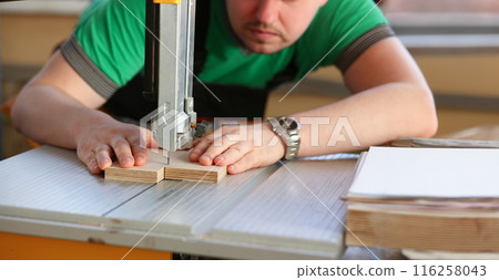 Worker using electric saw, handyman on workplace, diy 116258043