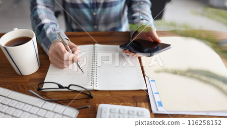 Person start day right with planner and cup of coffee, make appointment, plan 116258152