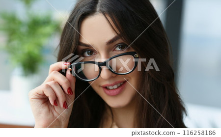 Beautiful brunette adult woman touch glasses frame, attractive young female 116258186