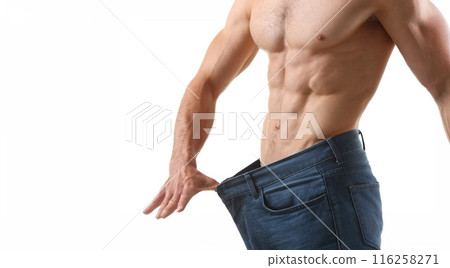Strong fit man with muscle and six-pack abs, slim body, perfect figure, big pants 116258271