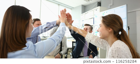 Witty colleagues performing high five gesture, successful profitable project, change future of corporation 116258284