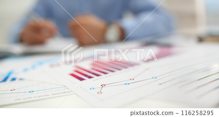 Agreement form, annual report in finance, mess with papers on desk Agreement form, annual report in finance, mess with papers on desk 116258295
