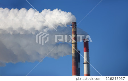 Power station with three smoke stacks, smoking pipes of heating supplying heat to city 116258937