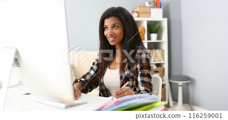 Smiling afro american woman on workplace, work as secretary, student on remote education 116259001