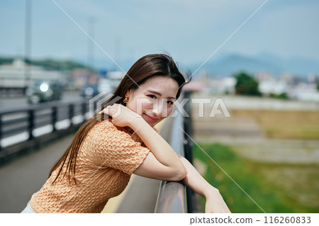 A young woman looking at the camera A young woman looking at the camera 116260833