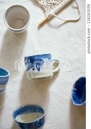 Ceramic cup on a textile 116261039