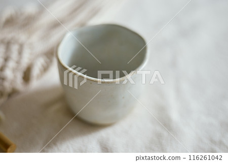 Ceramic cup on a textile Ceramic cup on a textile 116261042