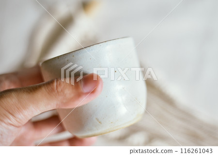 Ceramic cup on a textile Ceramic cup on a textile 116261043