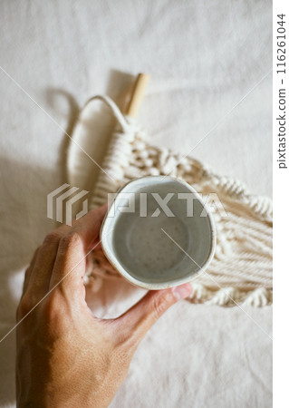 Ceramic cup on a textile Ceramic cup on a textile 116261044
