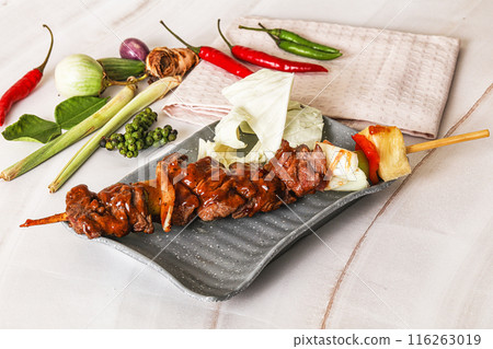 Asian grilled beef skewer with vegetables and pineapple 116263019