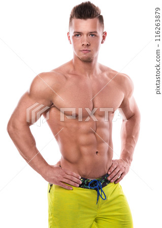 Fitness model in green shorts over white background Fitness model in green shorts over white background 116263879