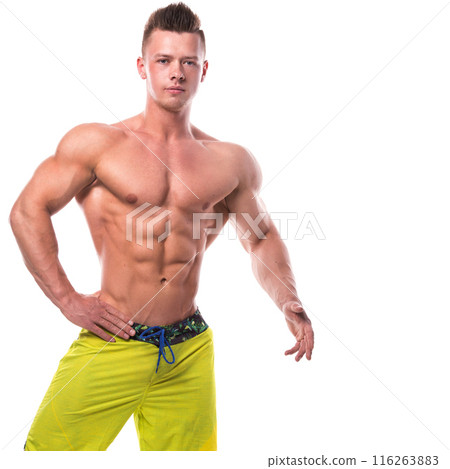 Fitness model in green shorts over white background 116263883
