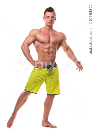 Fitness model in green shorts over white background 116263893