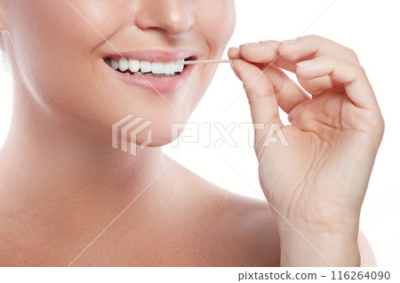 Close up of female teeth and toothpick Close up of female teeth and toothpick 116264090
